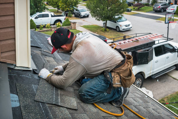 Professional Gutter Installation technician working in Lexington, MA